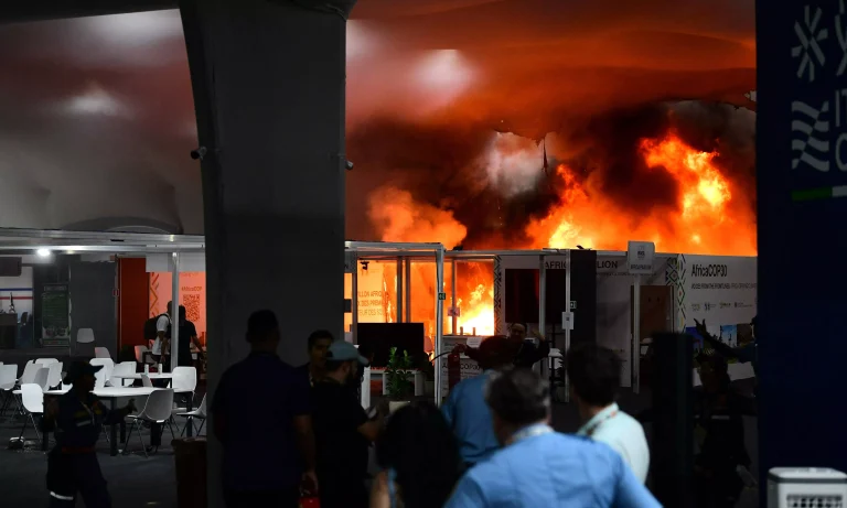 Delegates evacuating safely during a brief fire incident at the COP30 Climate Summit.