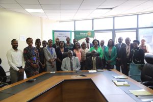 Ministry of Water and Environment officials and Rotary members after signing an MoU to restore 100 hectares of Bukaleba Central Forest Reserve.